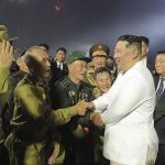 
              In this photo provided by the North Korean government, North Korean leader Kim Jong Un, third right, shakes hands with war veterans during a ceremony to mark the 69th anniversary of the signing of the ceasefire armistice that ends the fighting in the Korean War, in Pyongyang, North Korea Wednesday, July 27, 2022. Independent journalists were not given access to cover the event depicted in this image distributed by the North Korean government. The content of this image is as provided and cannot be independently verified. Korean language watermark on image as provided by source reads: "KCNA" which is the abbreviation for Korean Central News Agency. (Korean Central News Agency/Korea News Service via AP)
            