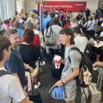 
              Travelers wait to board a flight to Chicago at Hartsfield-Atlanta International Airport on Thursday, June 30, 2022 in Atlanta. (AP Photo/Jay Reeves)
            