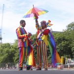 
              Md Nabir Uddim, left and Mohammed Nazir from London prepare, ahead of the Pride in London parade, Saturday, July 2, 2022, marking the 50th Anniversary of the Pride movement in the UK. (James Manning/PA via AP)
            