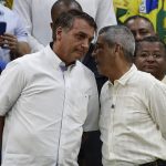 
              Brazil's President Jair Bolsonaro, who is running for a second term, left, alks with his running-mate General Braga Neto during a rally to launch his reelection bid, in Rio de Janeiro, Brazil, Sunday, July 24, 2022. Brazil's general elections are scheduled for Oct. 2, 2022. (AP Photo/Bruna Prado)
            