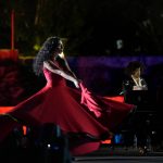 
              French Pianist Simon Ghraichy performs next to French-Iranian dancer Rana Gorgani during a concert in the ancient northeastern city of Baalbek, Lebanon, Sunday, July 17, 2022. Lebanon's renowned Baalbek Festival is back, held in front of a live audience for the first time in two years amid an ongoing economic meltdown. (AP Photo/Hassan Ammar)
            