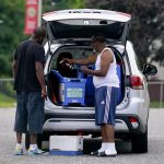 
              Election workers scan a box after collecting ballots from a drop box during Maryland's primary election, Tuesday, July 19, 2022, in Baltimore. (AP Photo/Julio Cortez)
            