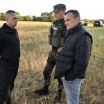 
              In this photo provided by the Serbian Minstry of Interior, Serbian Interior Minister Aleksandar Vulin, left, talks to Serbian gendarme officers after a police operation near Subotica, Northern Serbia, Wednesday, July 13, 2022. Authorities in Serbia have detained 85 migrants near the border with Hungary, where a clash earlier this month apparently involving people smugglers left one person dead and several injured. (Serbian Ministry of Interior via AP)
            