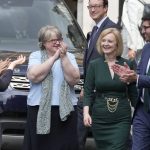
              Britain's Secretary of State for Foreign, Commonwealth and Development Affairs, Liz Truss receives applause from her team near Parliament in London, Wednesday, July 20, 2022. Britain’s Conservative Party has chosen Rishi Sunak and Liz Truss as the two finalists in an election to replace Prime Minister Boris Johnson. The pair came first and second in a vote of Conservative lawmakers on Wednesday. (AP Photo/Frank Augstein)
            
