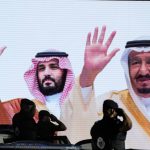 
              FILE - Saudi special forces salute in front of a screen displaying images Saudi King Salman, right, and Crown Prince Mohammed bin Salman after a military parade in preparation for the annual Hajj pilgrimage, in the Muslim holy city of Mecca, Saudi Arabia, July 3, 2022. President Joe Biden will visit the Middle East this week at a time when the region is experiencing dramatic changes and struggling to address deep problems. He'll become the first U.S. president to travel directly from Israel to Saudi Arabia, a reflection of closer ties between the Jewish state and its Arab neighbors. (AP Photo/Amr Nabil, File)
            