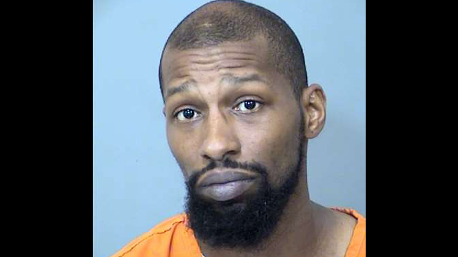 Jermaine Lamar Houston poses for mug shot after his arrest....