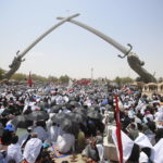 
              FILE - Followers of Shiite cleric Muqtada al-Sadr gather during an open-air Friday prayers at Grand Festivities Square within the Green Zone, in Baghdad, Iraq, Friday, Aug. 5, 2022. Al-Sadr is a populist cleric, who emerged as a symbol of resistance against the U.S. occupation of Iraq after the 2003 invasion. (AP Photo/Anmar Khalil, File)
            