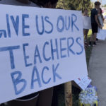 
              Teachers march on sidewalks outside Whetstone High School in Columbus, Ohio, as part of a district-wide teacher's strike on Wednesday, Aug. 24, 2022. A strike by teachers in Ohio's largest school district entered its third day Wednesday — the first day of school for some 47,000 students, with some of those students and their parents rallying to their sides.  (AP Photo/Samantha Hendrickson)
            