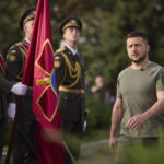 
              In this photo provided by the Ukrainian Presidential Press Office, Ukrainian President Volodymyr Zelenskyy walks in front of honour guards as he arrives for State Flag Day celebrations in Kyiv, Ukraine, Tuesday, Aug. 23, 2022. (Ukrainian Presidential Press Office via AP)
            