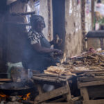 
              A woman fries fish for sale at a stall on a street in the Kibera area of Nairobi, Kenya Friday, Aug. 12, 2022. Vote-tallying in Kenya's close presidential election isn't moving fast enough, the electoral commission chair said Friday. (AP Photo/Ben Curtis)
            