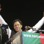 
              FILE - Former Pakistani Prime Minister Imran Khan waves to his supporters during an anti government rally, in Lahore, Pakistan, April 21, 2022. Pakistani police have filed terrorism charges against Khan, authorities said Monday, Aug. 22, 2022, escalating political tensions in the country as he holds mass rallies seeking to return to office. (AP Photo/K.M. Chaudary, File)
            
