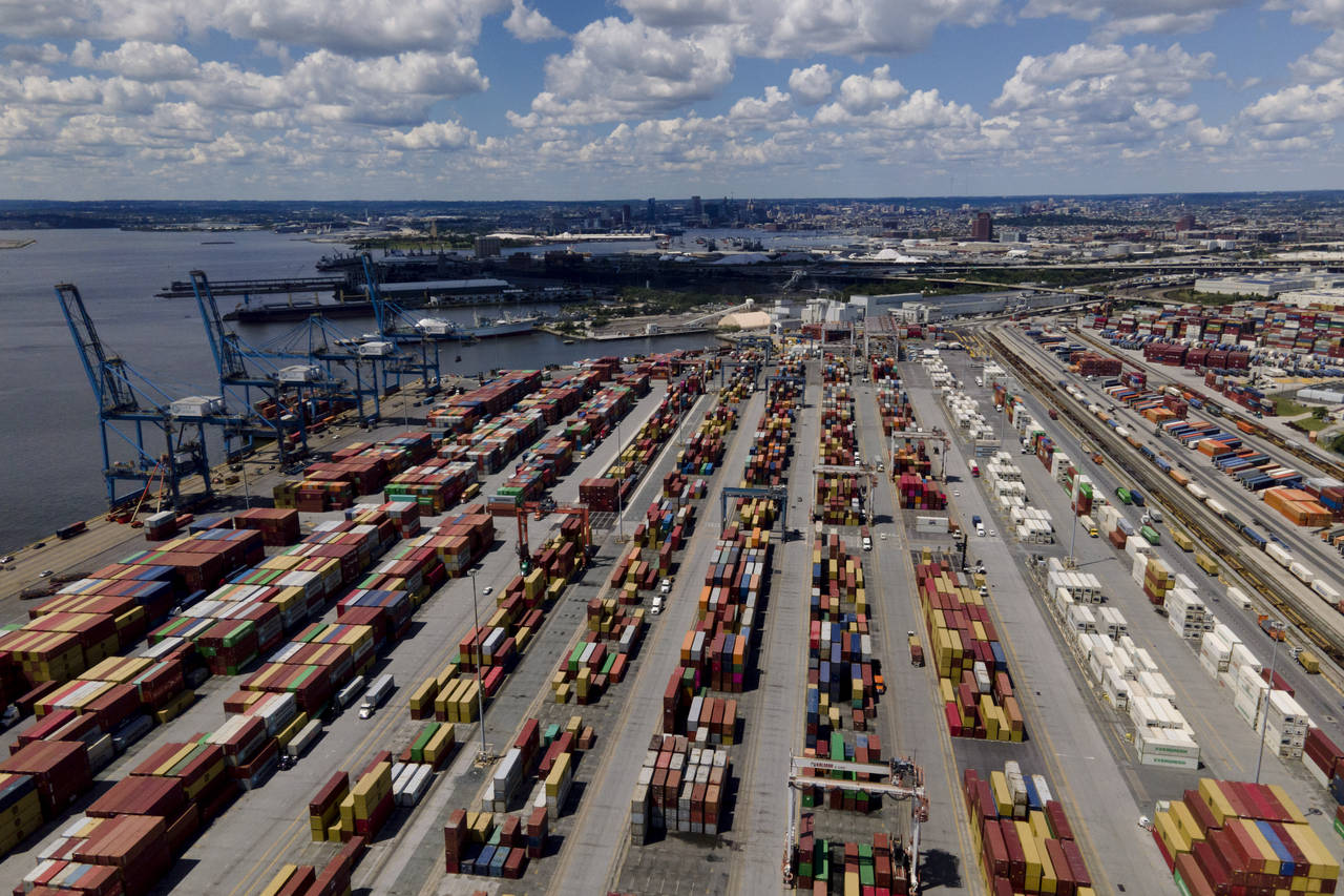 Shipping containers are stacked together at the Port of Baltimore, Friday, Aug. 12, 2022, in Baltim...