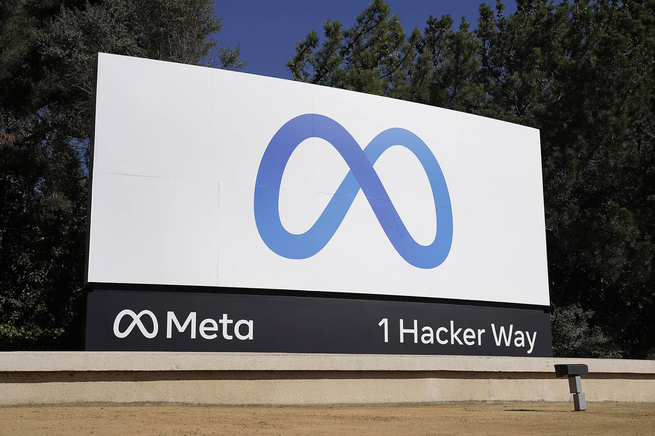 FILE - Facebook's Meta logo sign is seen at the company headquarters in Menlo Park, Calif. on Oct. ...