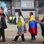 
              Supporters of new President Gustavo Petro line up to enter the Bolivar square to attend his swearing-in ceremony in Bogota, Colombia, Sunday, Aug. 7, 2022. (AP Photo/Ariana Cubillos)
            