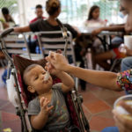 
              Eimy Morloy feeds her son Julen Morloy at the Colombian-Venezuelan Foundation "Nueva Ilusión", near the border with Venezuela, in Los Patios, Colombia, Saturday, Aug. 6, 2022. Morloy crossed the border so she could give her one-month-old son what she says are essential vaccines. (AP Photo/Matias Delacroix)
            