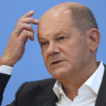 
              German Chancellor Olaf Scholz addresses the media during his first annual summer news conference in Berlin, Germany, Thursday, Aug. 11, 2022. (AP Photo/Michael Sohn)
            