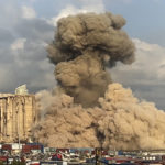 
              This image from a video, shows smoke and dust rising from collapsing silos damaged during the August 2020 massive explosion in the port, in Beirut, Lebanon, Tuesday, Aug. 23, 2022. The ruins of the Beirut Port silos' northern block that withstood a devastating port explosion two years ago has collapsed. The smoldering structure fell over on Tuesday morning into a cloud of dust, leaving the southern block standing next to a pile of charred ruins. (AP Photo/Lujain Jo)
            