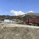 
              In this early 2022 photo provided by Global Witness, a truck drives through an area near Pangwa, Myanmar, near the border with China. Trucks like these are used to transport mined rare earth materials from Myanmar to China, where it will be processed and put into high tech products that end up on the international market. (Global Witness via AP)
            
