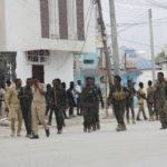 
              FILE - Security forces patrol at the scene, after gunmen stormed the Hayat Hotel in the capital Mogadishu, Somalia, on Aug, 20, 2022. The deadly siege was the longest such attack in the country's history taking more than 30 hours for security forces to subdue the extremists, with more than 20 people killed. (AP Photo/Farah Abdi Warsameh, File)
            