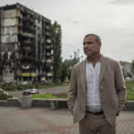 
              American actor Liev Schreiber speaks to media in front of a house which have been destroyed by Russia bombardment in Borodianka, near Kyiv, Ukraine, on Monday, Aug. 15, 2022. (AP Photo/Evgeniy Maloletka)
            