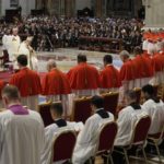 
              Pope Francis prays in front of new Cardinals during consistory inside St. Peter's Basilica, at the Vatican, Saturday, Aug. 27, 2022. Pope Francis has chosen 20 men to become the Catholic Church's newest cardinals. (AP Photo/Andrew Medichini)
            