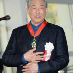 
              This photo shows Issey Miyake when he received the Legion of Honor from the French government, at the National Art Center in Tokyo on March 15, 2016. Miyake, who built one of Japan’s biggest fashion brands and was known for his boldly sculpted, signature pleated pieces, has died. He was 84. Miyake died Aug. 5 of liver cancer, Miyake Design Office said Tuesday, Aug. 9, 2022. (Kyodo News via AP)
            