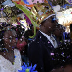
              Adonildes da Cunha, right, Emperor, and Nilda dos Santos, left, Queen, arrive for a celebration after a Mass in the chapel of the Kalunga quilombo, during the culmination of the week-long pilgrimage and celebration for the patron saint "Nossa Senhora da Abadia" or Our Lady of Abadia, in the rural area of Cavalcante in Goias state, Brazil, Monday, Aug. 15, 2022. Devotees, who are the descendants of runaway slaves, celebrate Our Lady of Abadia at this time of the year with weddings, baptisms and by crowning distinguished community members, as they maintain cultural practices originating from Africa that mix with Catholic traditions. (AP Photo/Eraldo Peres) (AP Photo/Eraldo Peres)
            