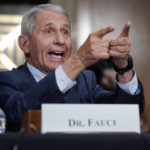 
              FILE - Dr. Anthony Fauci, director of the National Institute of Allergy and Infectious Diseases, responds to accusations by Sen. Rand Paul, R-Ky., as he testifies before the Senate Health, Education, Labor, and Pensions Committee about the origin of COVID-19, on Capitol Hill in Washington, July 20, 2021. Fauci, the nation's top infectious disease expert who became a household name, and the subject of partisan attacks, during the COVID-19 pandemic, announced Monday he will depart the federal government in December after more than 5 decades of service.   (AP Photo/J. Scott Applewhite, Pool, File)
            