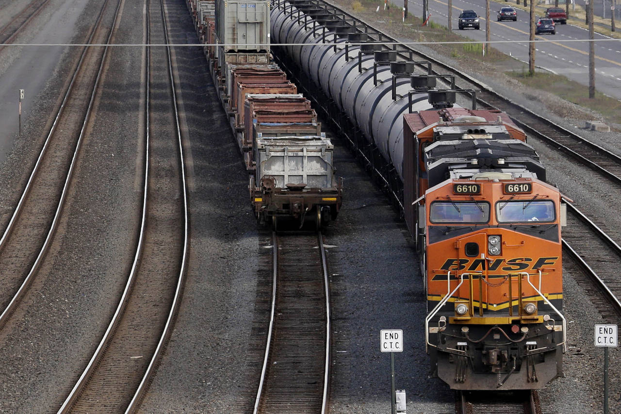 FILE - In this July 27, 2015, file photo, a BNSF Railway Company train is parked in Seattle. The he...