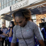 
              Serena Williams walks to a practice session before playing against Danka Kovinic, of Montenegro, during the first round of the US Open tennis championships, Monday, Aug. 29, 2022, in New York. (AP Photo/John Minchillo)
            