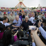 
              Former Vice President Mike Pence speaks to the media during a visit to the Iowa State Fair, Friday, Aug. 19, 2022, in Des Moines, Iowa. Potential White House hopefuls from both parties often swing by Iowa's legendary state fair during a midterm election year to connect with voters who could sway the nomination process. But this year, the traffic at the fair was noticeably light. Democrats are uncertain about President Joe Biden's political future and many Republicans avoid taking on former President Donald Trump. (AP Photo/Charlie Neibergall)
            