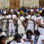
              Arahuaco Indigenous people wait for the start of the swearing-in ceremony for new President Gustavo Peto at the Bolivar square in Bogota, Colombia, Sunday, Aug. 7, 2022. (AP Photo/Ariana Cubillos)
            