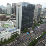 
              People attend a rally against North Korea on Korea's Liberation Day in Seoul, South Korea, Monday, Aug. 15, 2022. South Korean President Yoon Suk Yeol on Monday offered "audacious" economic assistance to North Korea if it abandons its nuclear weapons program while avoiding harsh criticism of the North days after it threatened "deadly" retaliation over the COVID-19 outbreak it blames on the South. (AP Photo/Ahn Young-joon)
            