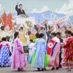 
              Citizens celebrate the in the plaza of the Arch of Triumph dressing in traditional costume to commemorate the 77th anniversary of Korea's Liberation in Pyongyang, North Korea, Monday, Aug. 15, 2022. (AP Photo/Cha Song Ho)
            