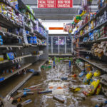 FILE - Damage from flooding is visible at Isom IGA in Isom, Ky., Aug. 1, 2022. The grocery store was ravaged by historic floods last week, and the store's inventory was spoiled by the flood waters. (Ryan C. Hermens/Lexington Herald-Leader via AP, File)