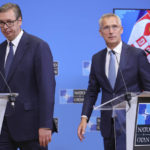
              NATO Secretary General Jens Stoltenberg, right, and Serbian President Aleksandar Vucic arrive for a media conference at NATO headquarters in Brussels, Wednesday, Aug. 17, 2022. (AP Photo/Olivier Matthys)
            