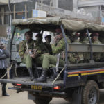 
              Police patrol an area ahead of the announcement of the election results in the town of Eldoret, Kenya, Thursday, Aug. 11, 2022. Kenyans are waiting for the results of a close presidential election in which the turnout was lower than usual. (AP Photo/Brian Inganga)
            