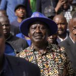 
              Kenyan presidential candidate Raila Odinga, center, departs after delivering an address to the nation at his campaign headquarters in downtown Nairobi, Kenya, Tuesday, Aug. 16, 2022. Kenya is calm a day after Deputy President William Ruto was declared the winner of the narrow presidential election over longtime opposition figure Raila Odinga. (AP Photo/Ben Curtis)
            