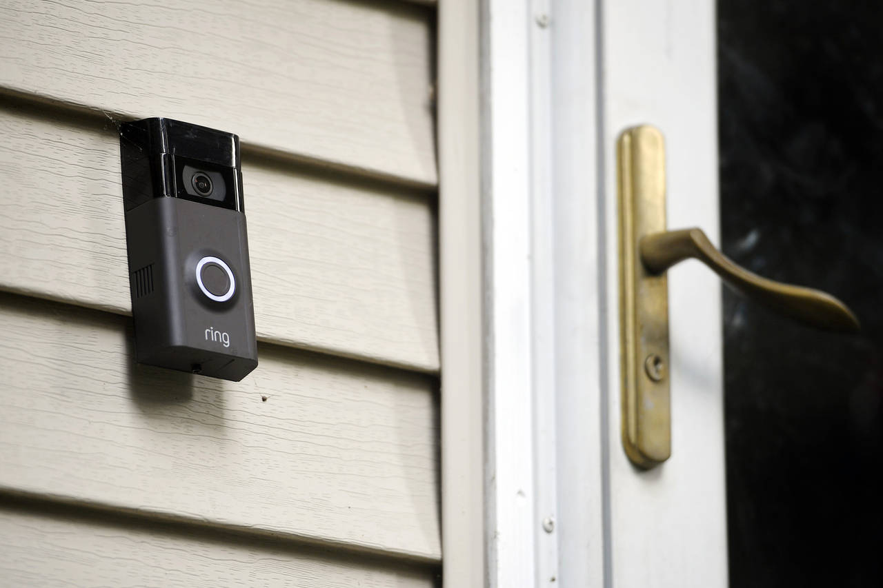 FILE - A Ring doorbell camera is displayed outside a home in Wolcott, Conn., on July 16, 2019. Two ...