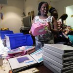 
              Aaliyah Floyd, 10, selects school supplies at the annual Back to School Distribution Day at The Pantry, Friday, July 29, 2022, in Fort Lauderdale, Fla. The Pantry works with grandparents who are the primary caregivers for their grandchildren, offering free backpacks, lunch boxes, school supplies and sneakers. This back-to-school shopping season, parents, particularly in the low to middle income bracket, are focusing on the basics, trading down to cheaper stores and stretching out their buying as surging inflation takes a toll on their household budgets. (AP Photo/Lynne Sladky)
            