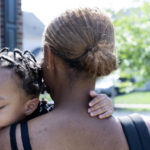 Aaliyah Wright, 25, of Washington, carries her son Khaza Wright, 1, to visit his grandmother in Accokeek, Md., Tuesday, Aug. 9, 2022. A landmark social program is being pioneered in the nation's capital. Coined "Baby Bonds," the program is designed to narrow the wealth gap. The program would provide children of the city's poorest families up to $25,000 when they reach adulthood. (AP Photo/Jacquelyn Martin)