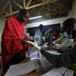 
              An elder man prepares to vote at the Oltepesi Primary School, Kajiado County in Nairobi, Kenya, Tuesday Aug. 9, 2022. Kenyans are voting to choose between opposition leader Raila Odinga and Deputy President William Ruto to succeed President Uhuru Kenyatta after a decade in power. (AP Photo/Ben Curtis)
            