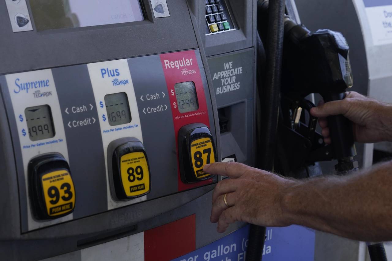 A customer pumps gas at an Exxon gas station, Tuesday, May 10, 2022, in Miami. Gasoline prices are ...
