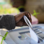 
              A man casts his ballots inside a polling station at the Kibera Primary School in Nairobi, Kenya, Tuesday, Aug. 9, 2022. Polls opened Tuesday in Kenya's unusual presidential election, where a longtime opposition leader who is backed by the outgoing president faces the deputy president who styles himself as the outsider. (AP Photo/Mosa'ab Elshamy)
            