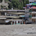 
              A man walks next to homes surrounded by floodwaters, in Kalam in Swat Valley, Pakistan, Tuesday, Aug. 30, 2022. Disaster officials say nearly a half million people in Pakistan are crowded into camps after losing their homes in widespread flooding caused by unprecedented monsoon rains in recent weeks. (AP Photo/Sherin Zada)
            