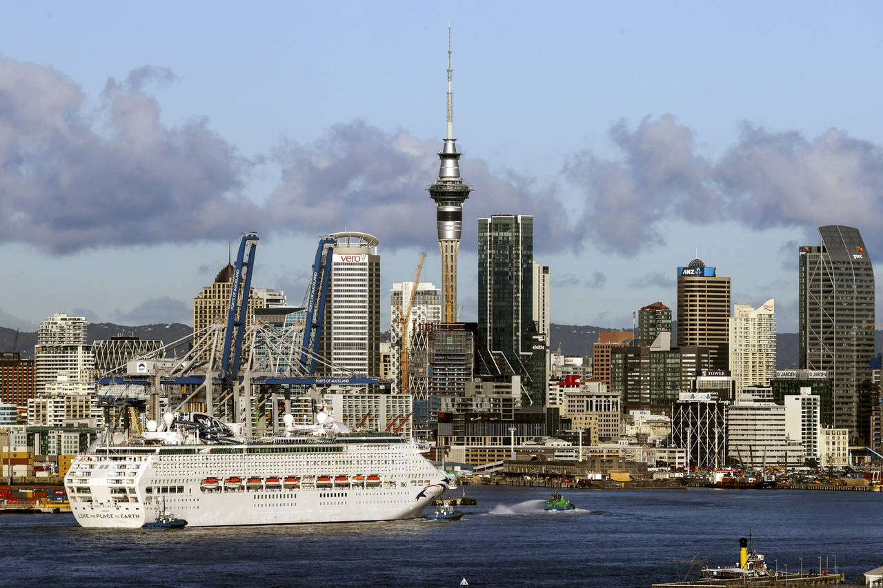 The Pacific Explorer sails into the Waitemata Harbour, in Auckland, New Zealand, Friday, Aug. 12, 2...