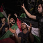
              Palestinians celebrate the cease-fire agreement between Israel and Islamic Jihad Movement in Gaza City, early Monday, Aug. 8, 2022. A cease-fire deal to end nearly three days of fighting between Israel and Palestinian militants has held throughout the night, signaling the latest round of violence may have abated. (AP Photo/Fatima Shbair)
            