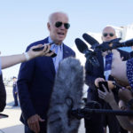 President Joe Biden speaks to the media before boarding Air Force One for a trip to Kentucky to view flood damage, Monday, Aug. 8, 2022, in Dover Air Force Base, Del. (AP Photo/Evan Vucci)