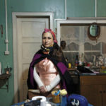 
              Cristina Aron, a Mapuche cultural liaison, poses for a photo in the kitchen of her home in Osorno, Chile, Sunday, Aug. 21, 2022. “Childbirth is a spiritual energy event for the mother, the baby and the community,” Aron says. (AP Photo/Luis Hidalgo)
            