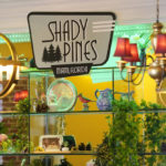 A sign referring to the Shady Pines Nursing Home in the television series "The Golden Girls" is pictured behind the bar at the Golden Girls Kitchen pop-up restaurant, Monday, July 25, 2022, in Beverly Hills, Calif. The pop-up only has reservations through the end of October. But there are plans to take it on the road to New York, Chicago, San Francisco and Miami. (AP Photo/Chris Pizzello)